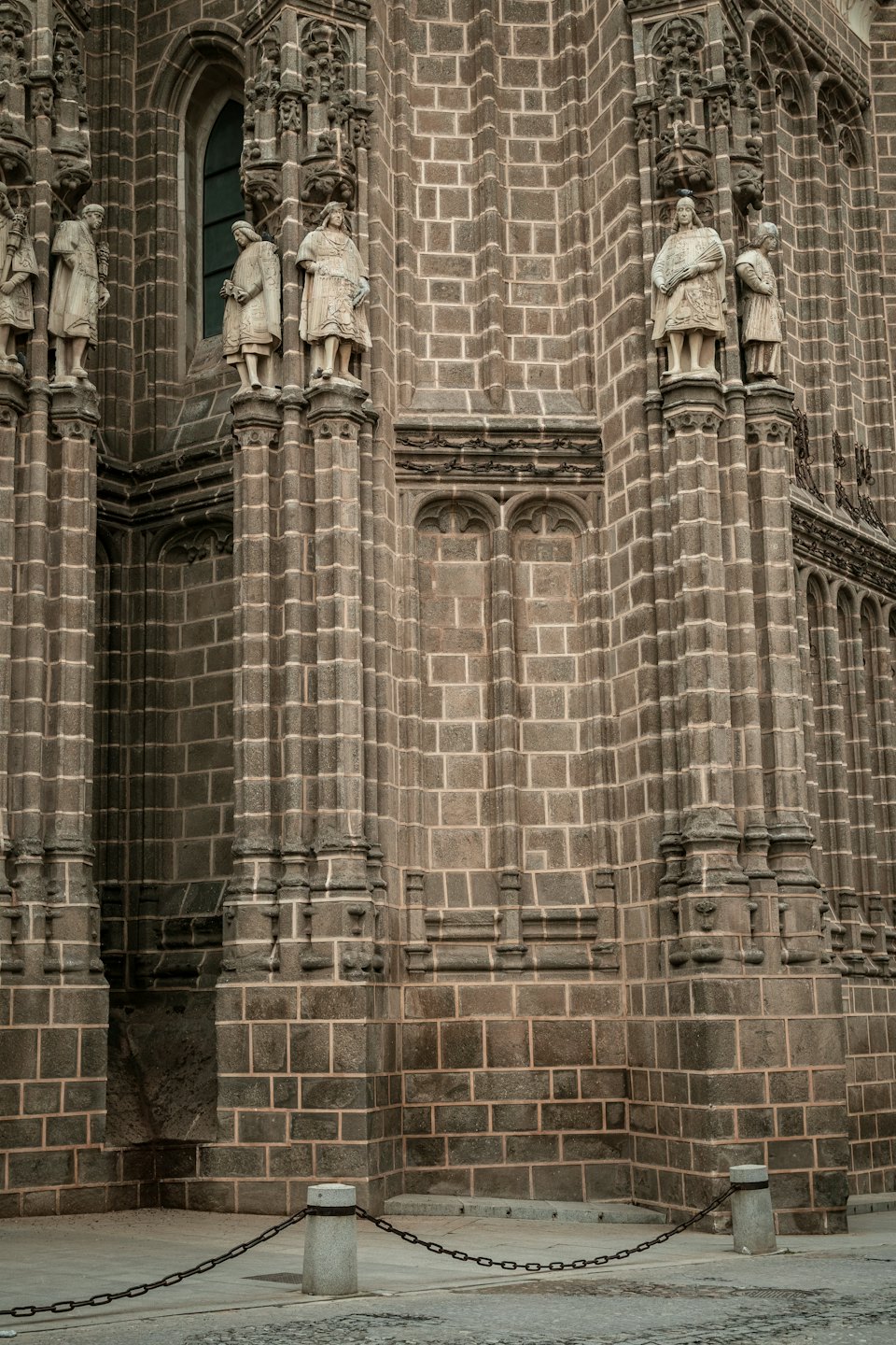 Ornate stone facade featuring carved statues and arched windows.